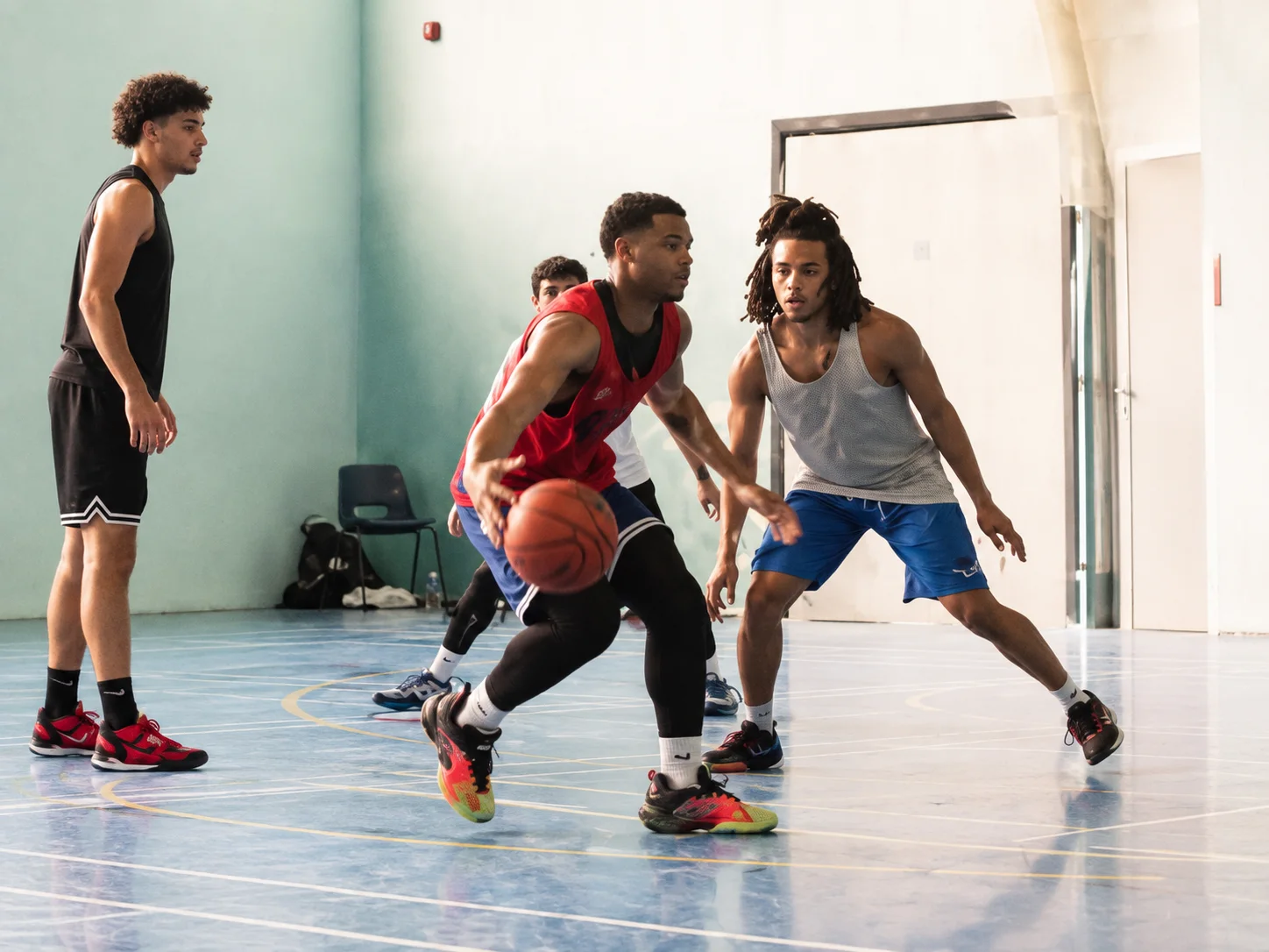 Young basketball players competing during a recruitment camp session
