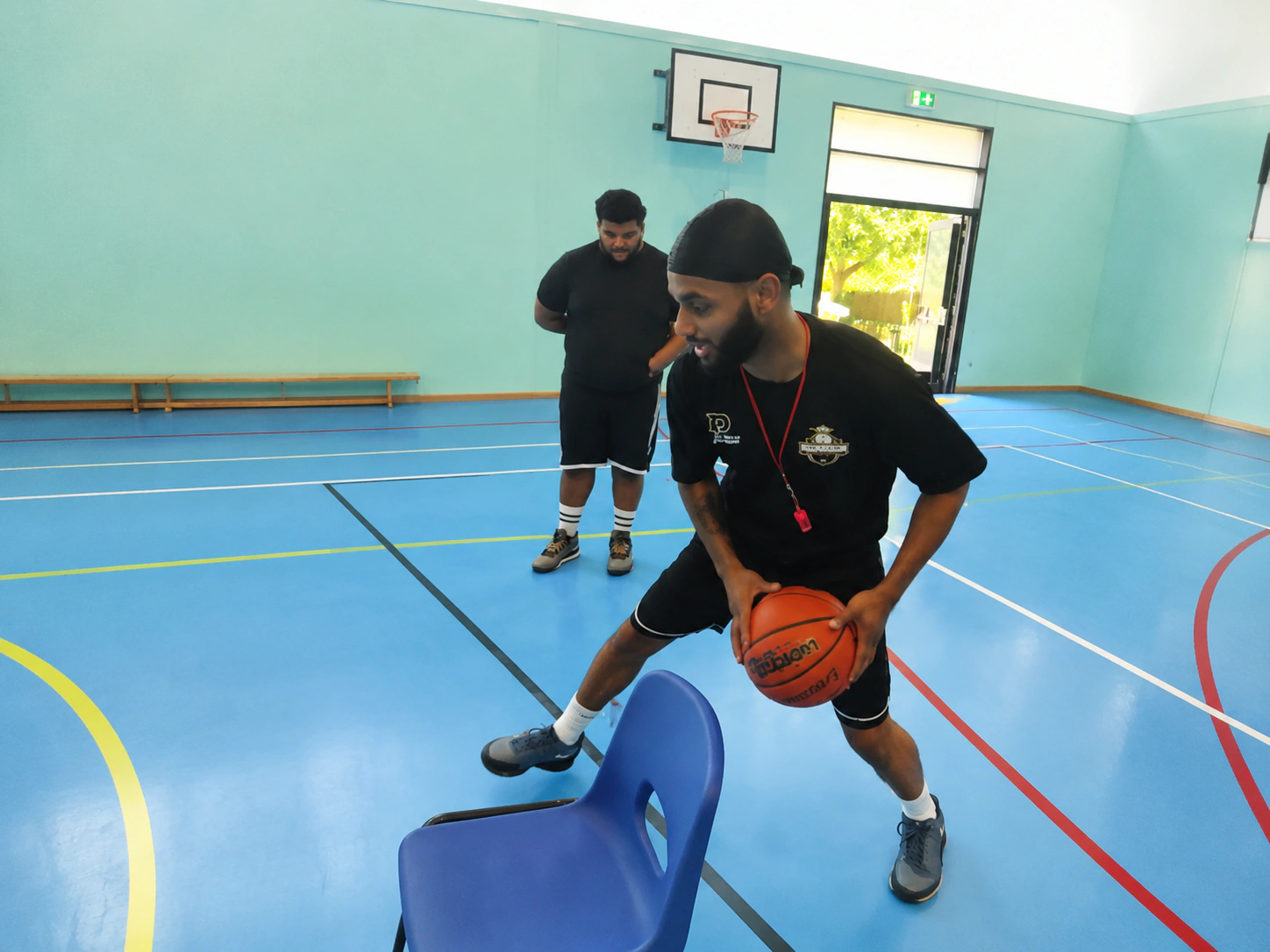 Young basketball player preparing to shoot during youth camp